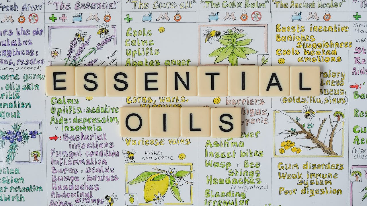 A visually engaging layout of letter tiles spelling essential oils over an informative background with illustrations.